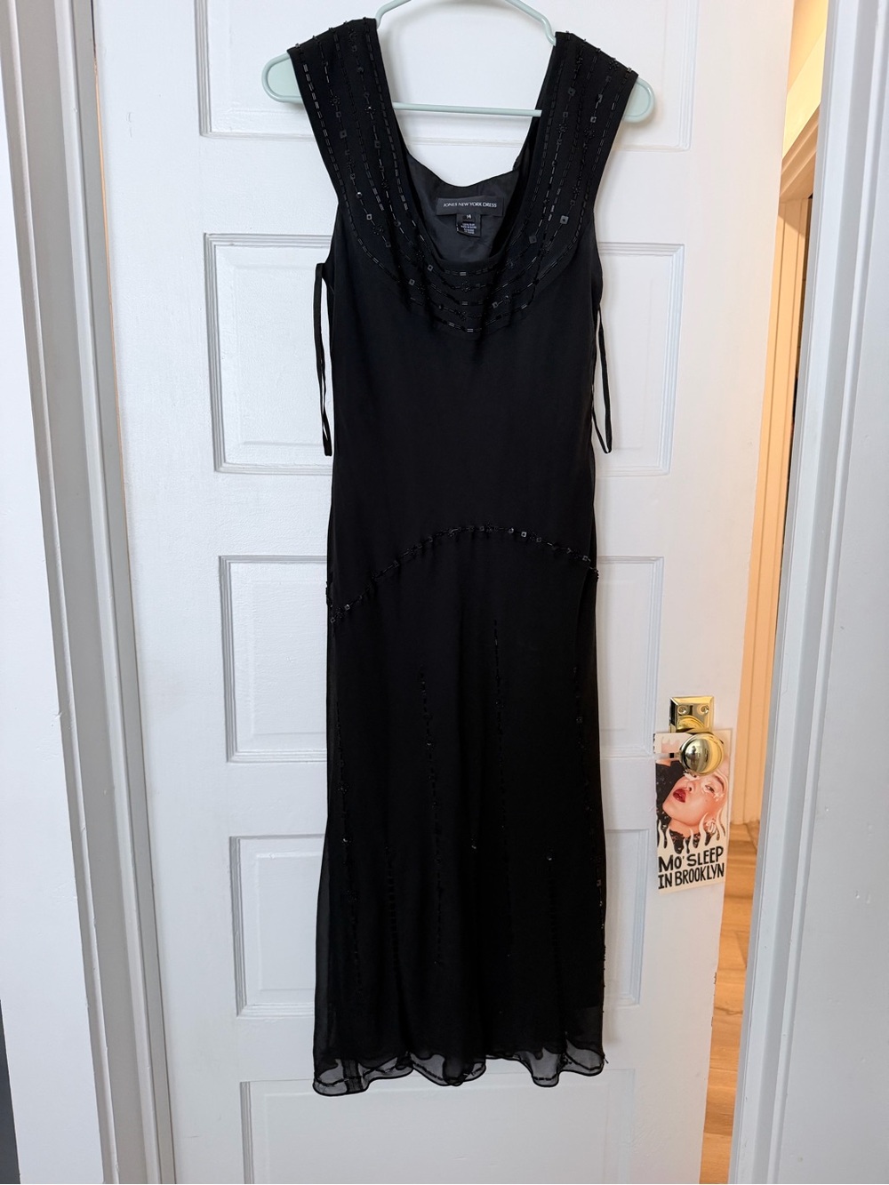vintage Jones New York 100% silk black gown featuring a beaded scoop necklin